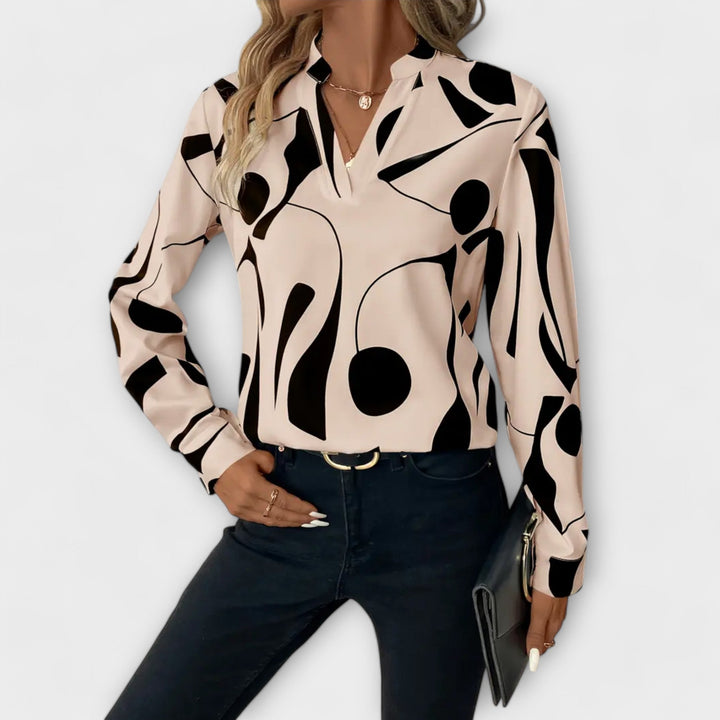 Elegant long-sleeved blouse with V-neck and geometric pattern