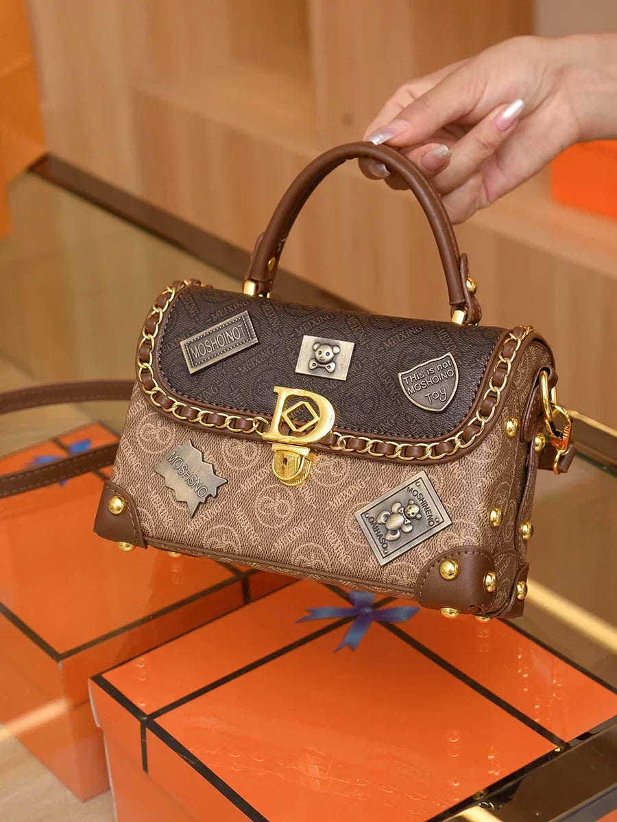 zelda | retro shoulder bag with monogram and gold details