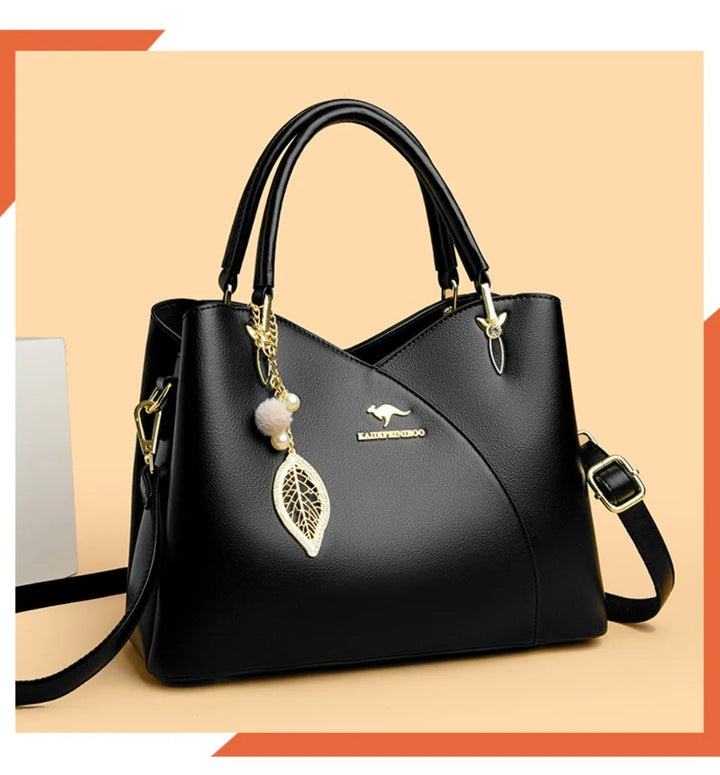 felina | black shoulder bag with elegant pendant