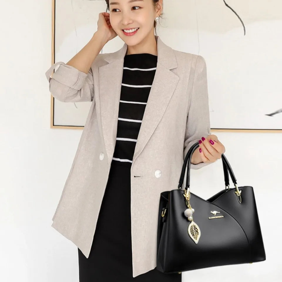 felina | black shoulder bag with elegant pendant