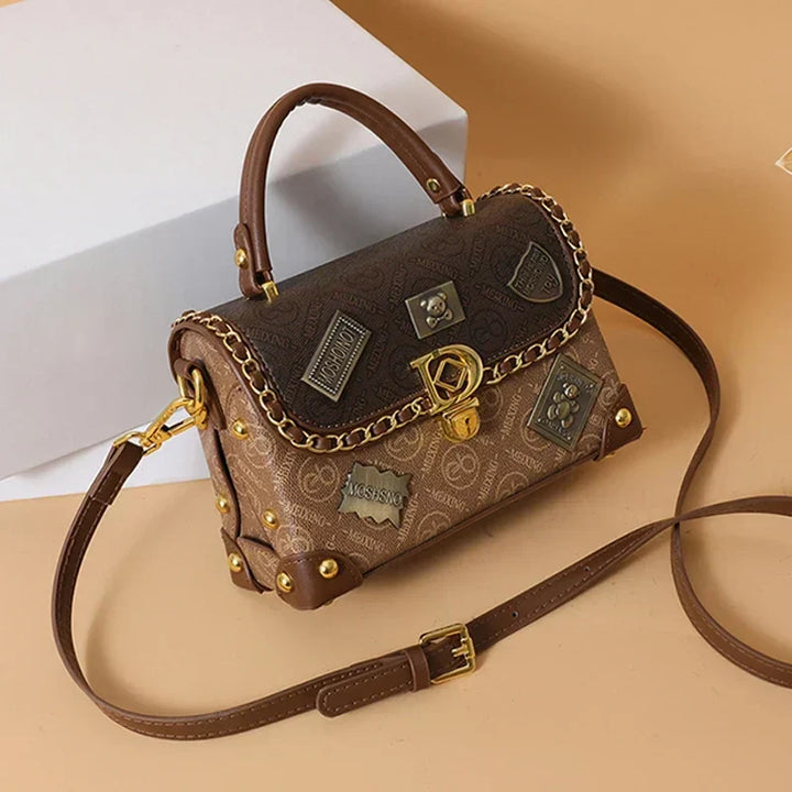 zelda | retro shoulder bag with monogram and gold details
