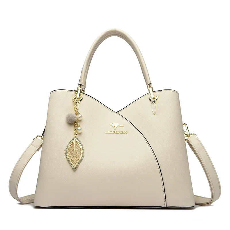 felina | black shoulder bag with elegant pendant