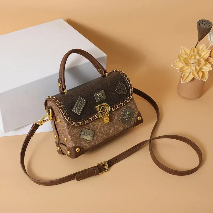 zelda | retro shoulder bag with monogram and gold details