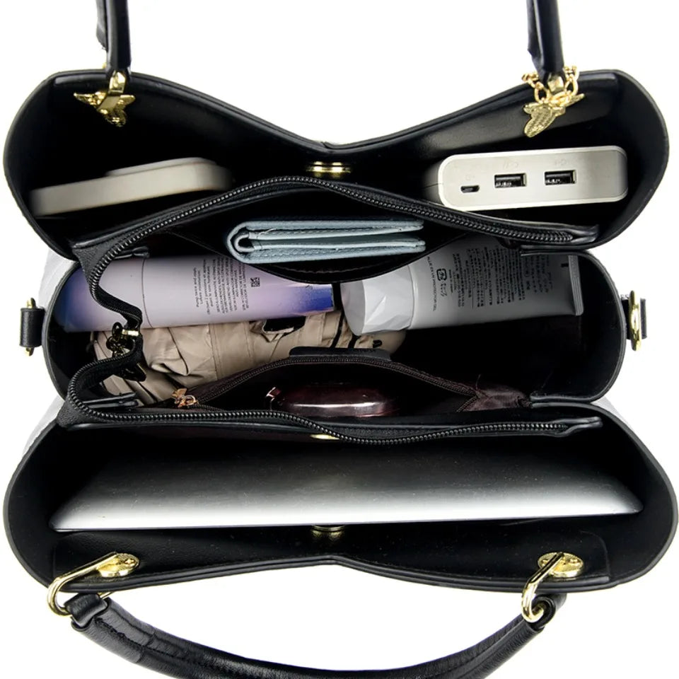 felina | black shoulder bag with elegant pendant