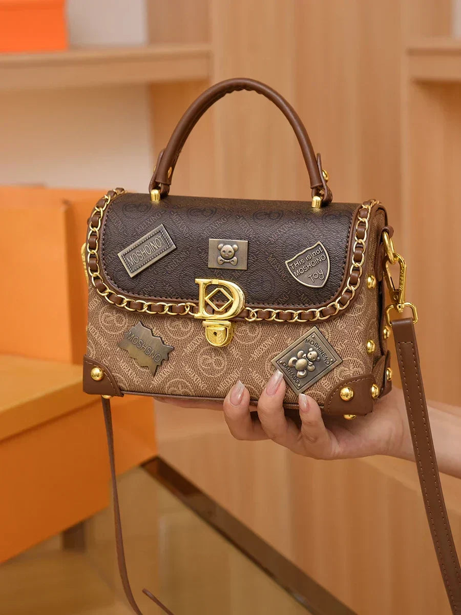zelda | retro shoulder bag with monogram and gold details