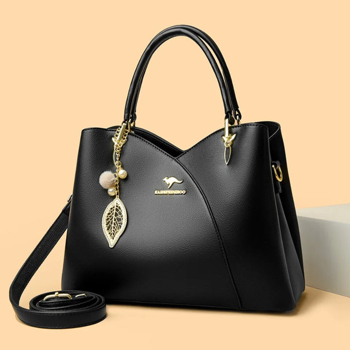 felina | black shoulder bag with elegant pendant