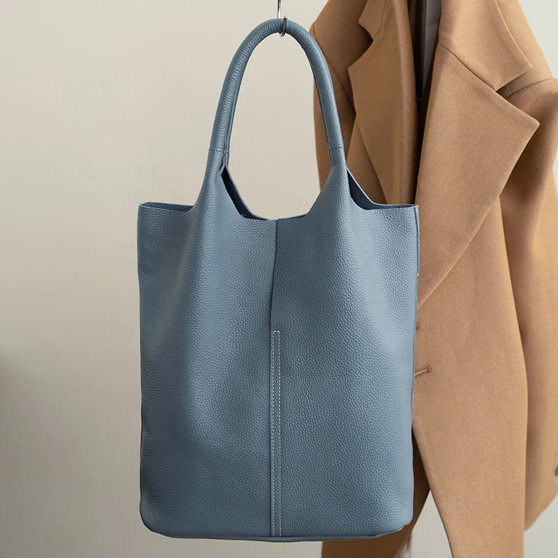 saga | ight blue bucket bag in luxury leather look