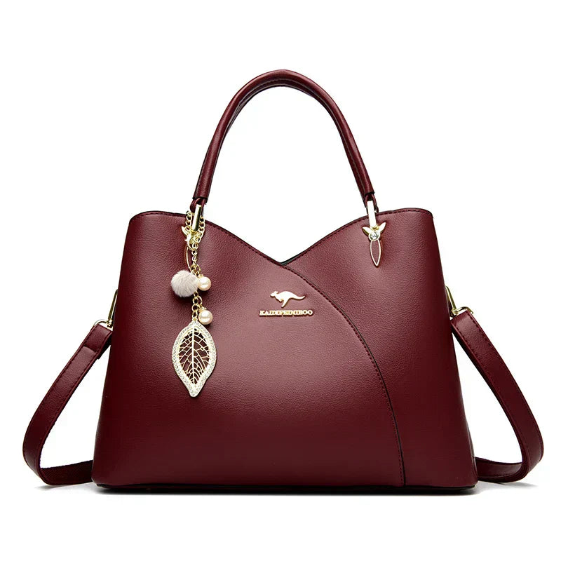 felina | black shoulder bag with elegant pendant
