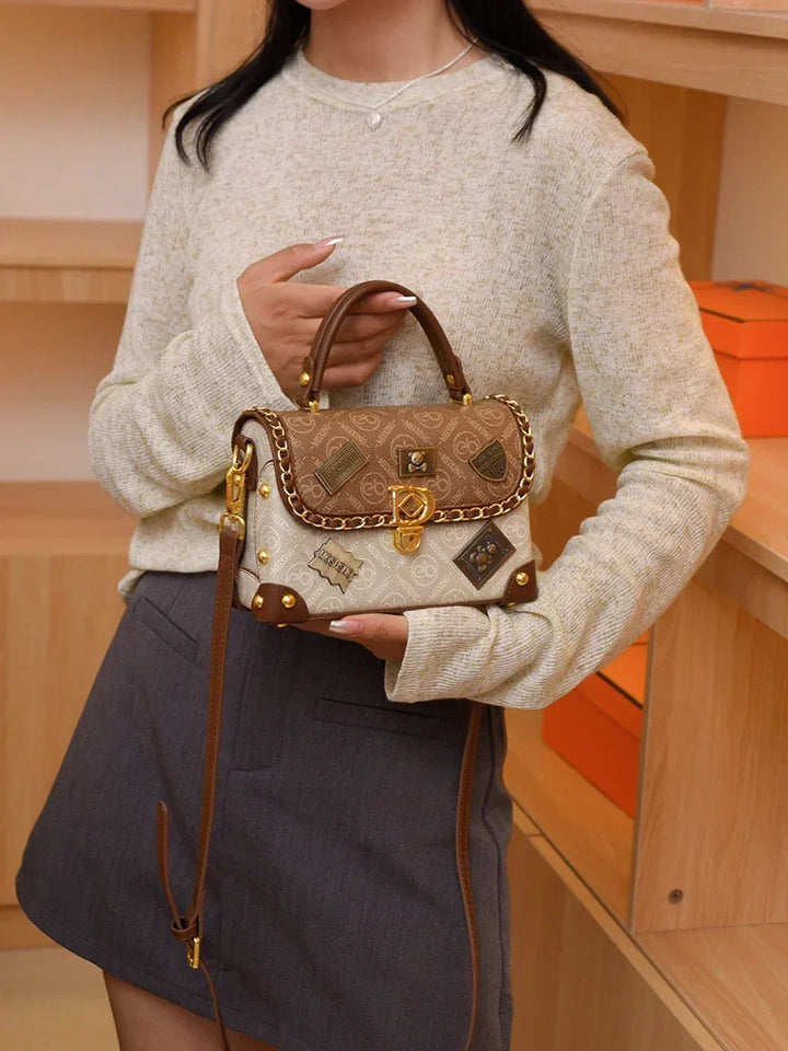 zelda | retro shoulder bag with monogram and gold details